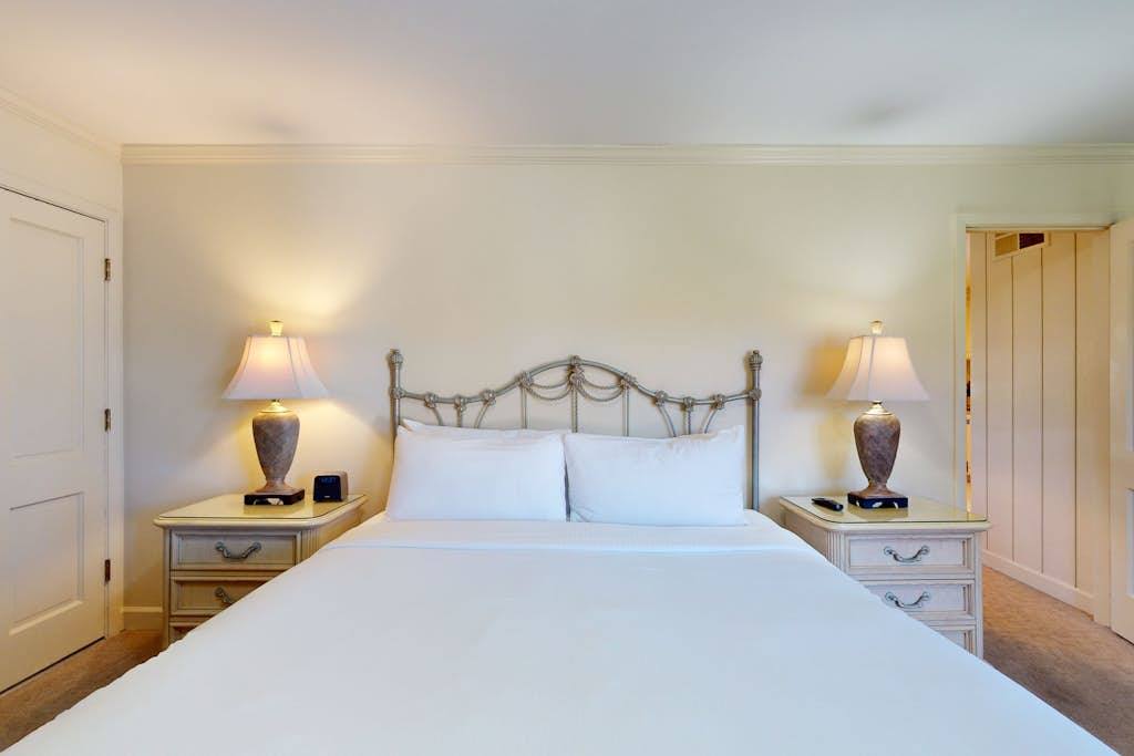 Sink into crisp white bedding and plush pillows on your king bed — the perfect end to a Napa Valley wine tour