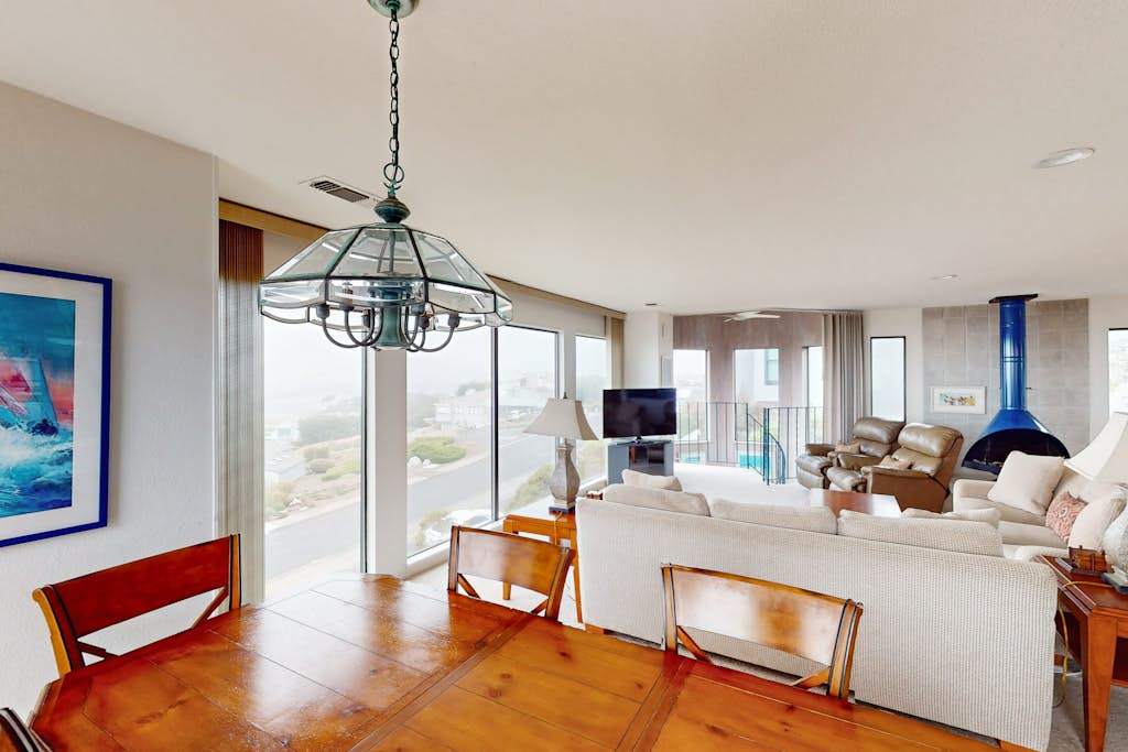 Gleaming hardwood floors connect your dining and living spaces in this airy Bodega Bay retreat with ocean views from every angle
