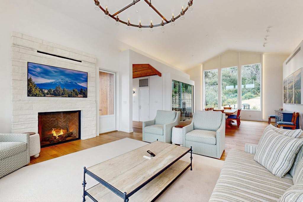 Curl up by your gas fireplace with a bold Calistoga Cab while the mounted TV plays softly — this living room was made for winding down after wine country adventures.