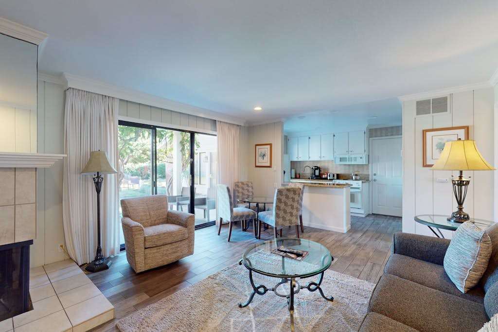 Settle into your sun-filled Napa Valley retreat with open-plan living, plush seating, and a breakfast bar perfect for planning your next wine country adventure.