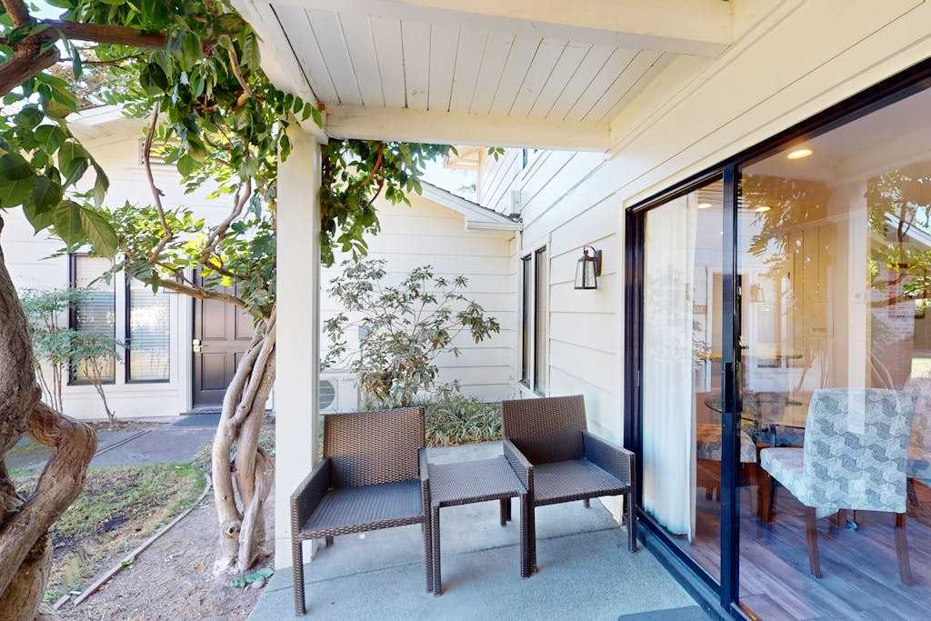 Unwind on your private covered patio beneath mature shade trees — the ideal spot to sip Napa Valley wine after a day of tasting.