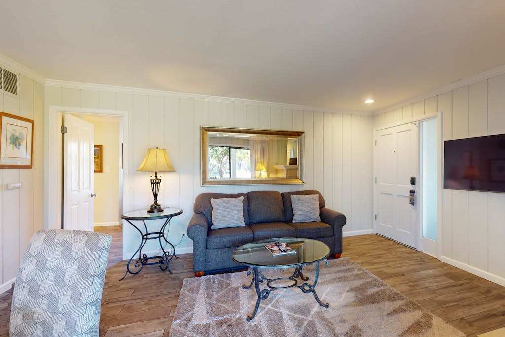Cozy evenings await in your Napa hideaway — sink into the sofa beneath soft lamplight with a flat-screen TV ready for movie night.