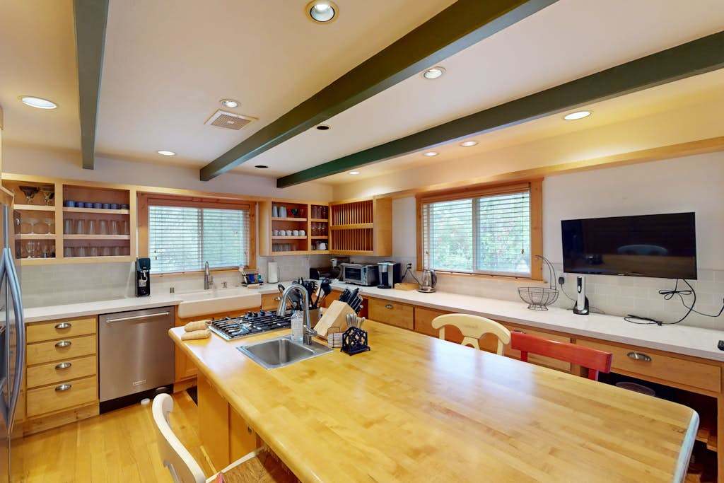 Channel your inner chef in this fully equipped kitchen — a generous butcher-block island, gas stove, and ample counter space make meal prep a breeze.