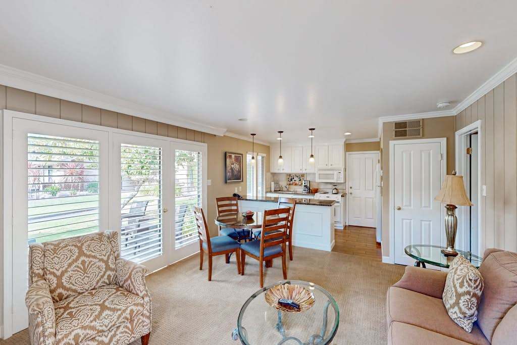 Gather in your sun-filled open living and dining space where French doors frame views of the Silverado Resort grounds
