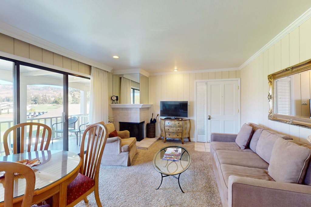 Unwind after a day exploring Napa wineries in your spacious living room — cozy up by the gas fireplace while enjoying views through the sliding glass doors.