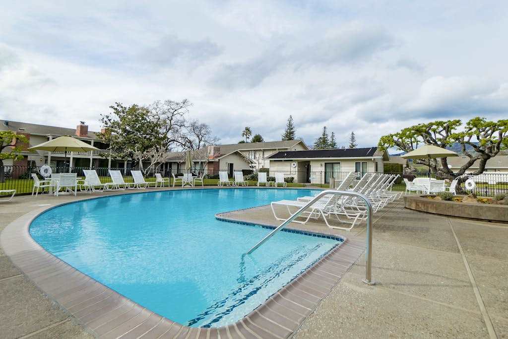 Take a refreshing dip in your resort's sparkling communal pool, surrounded by lounge chairs and Napa Valley sunshine — steps from your front door.