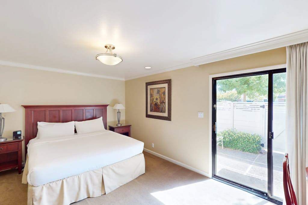 Drift off in your luxurious king bed with crisp white linens, then wake to Napa sunshine streaming through your private patio doors.