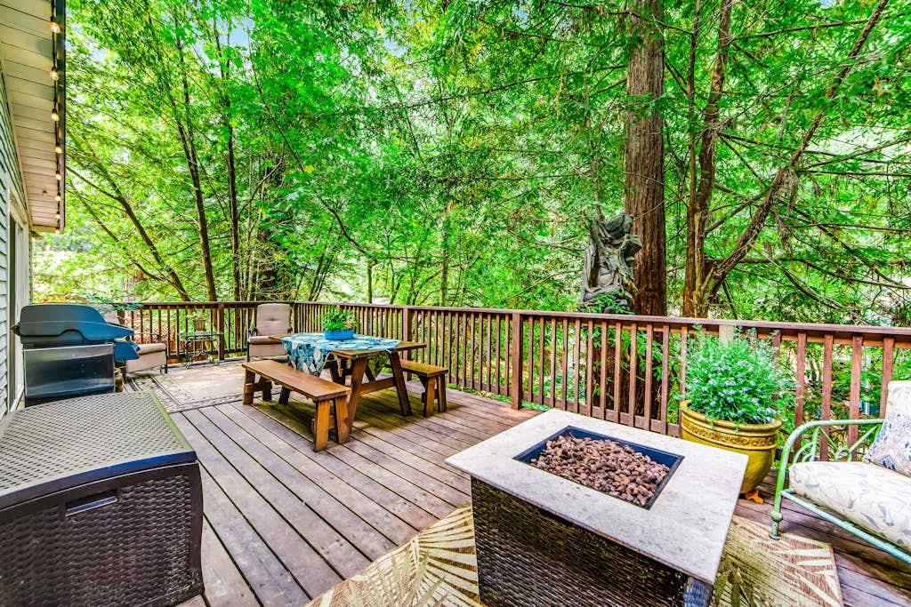 Dine under the redwoods at your picnic table, then pull up a chair by the fire pit — your outdoor living room is wrapped in Sonoma wine country's ancient forest.