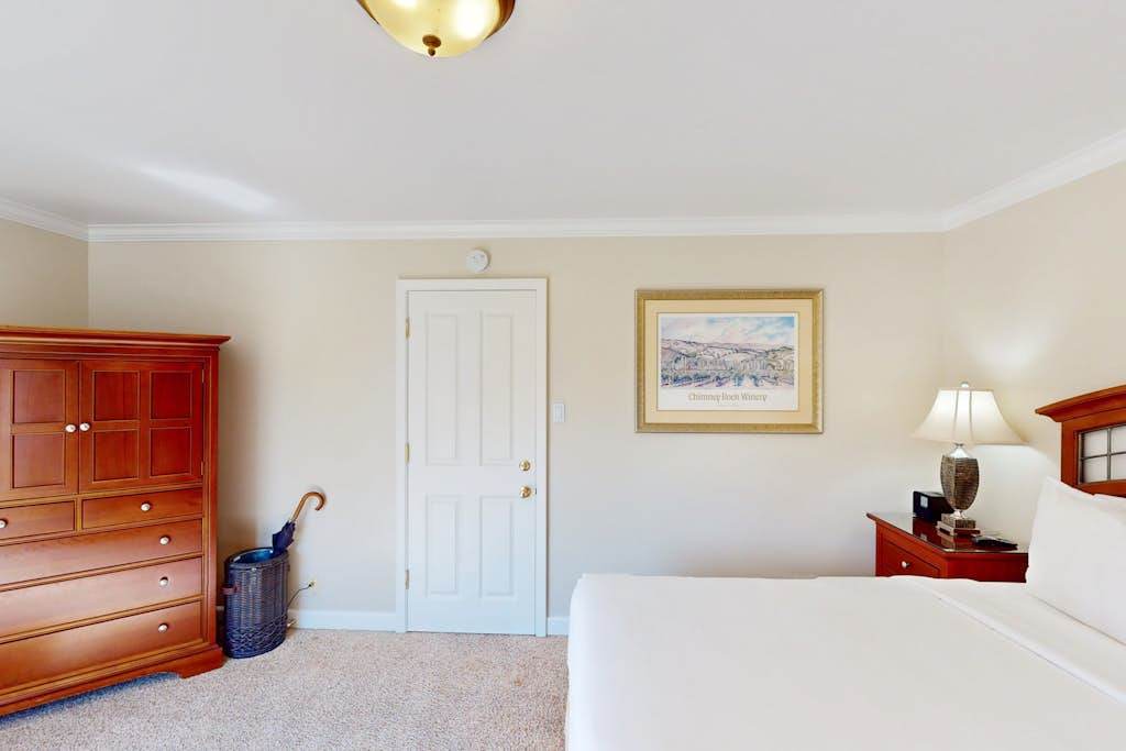 Unpack in style with your cherry wood armoire and dresser — your Napa Valley suite keeps everything organized for a relaxing stay