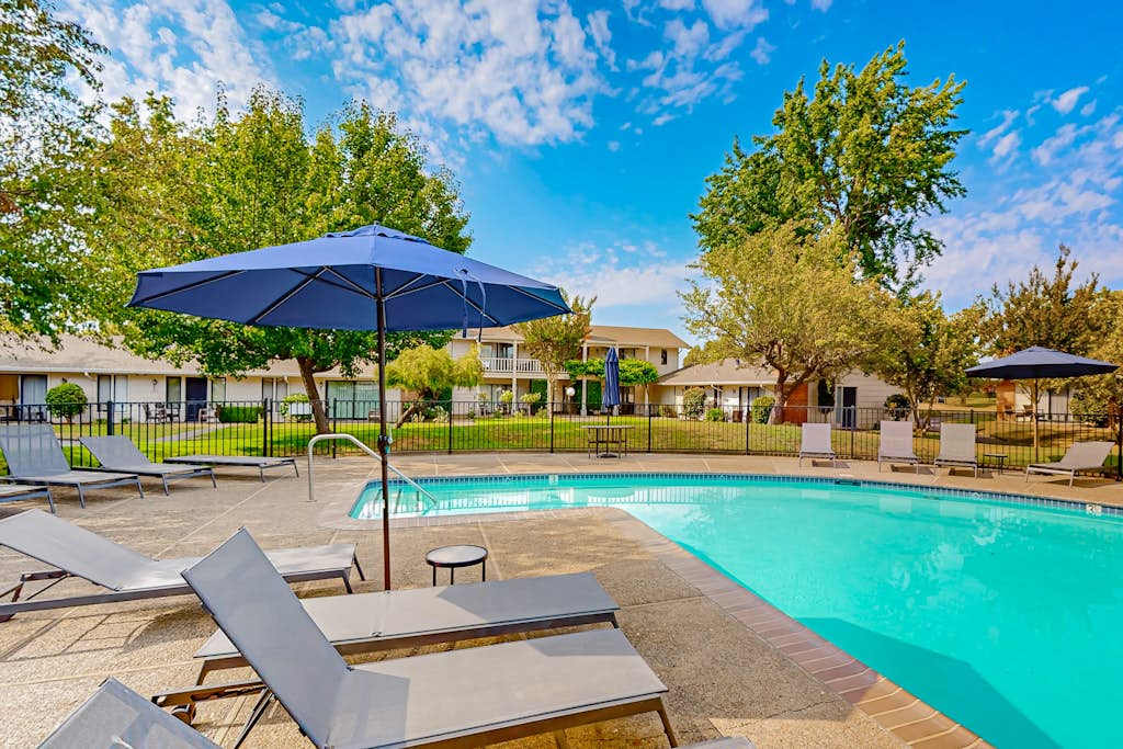 Lounge poolside under shady umbrellas at Silverado Resort — your perfect afternoon between Napa Valley wine tastings and vineyard tours