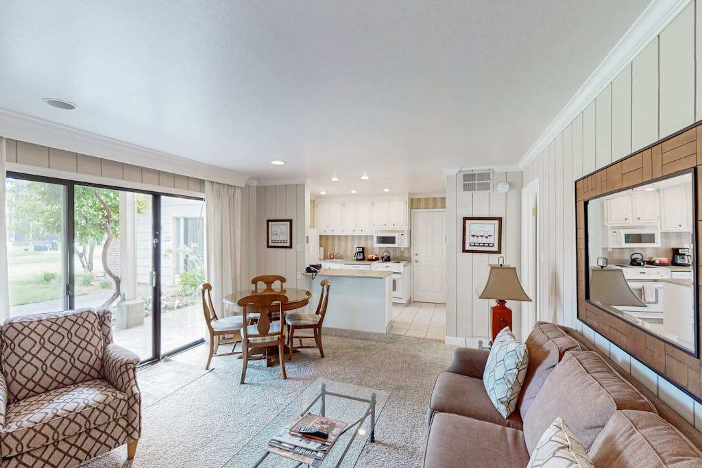 Settle into your sun-filled Napa Valley retreat with an open living area, dining space, and full kitchen — all connected by sliding glass doors to your private patio