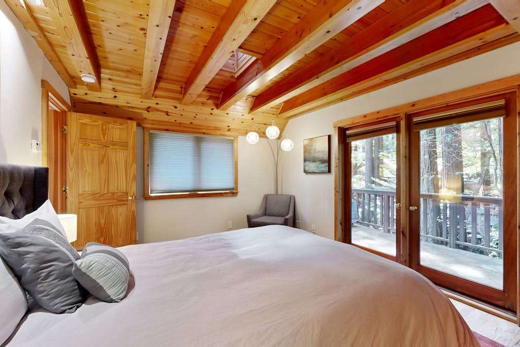 Nestle into your queen bed and gaze through the glass doors at your redwood cathedral — a reading chair beckons for lazy Sonoma County afternoons.