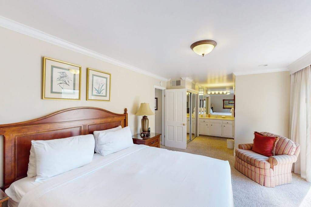 Your master suite features a king bed, en-suite bath, and a cozy reading chair — wake up refreshed and ready for another day in Napa Valley.
