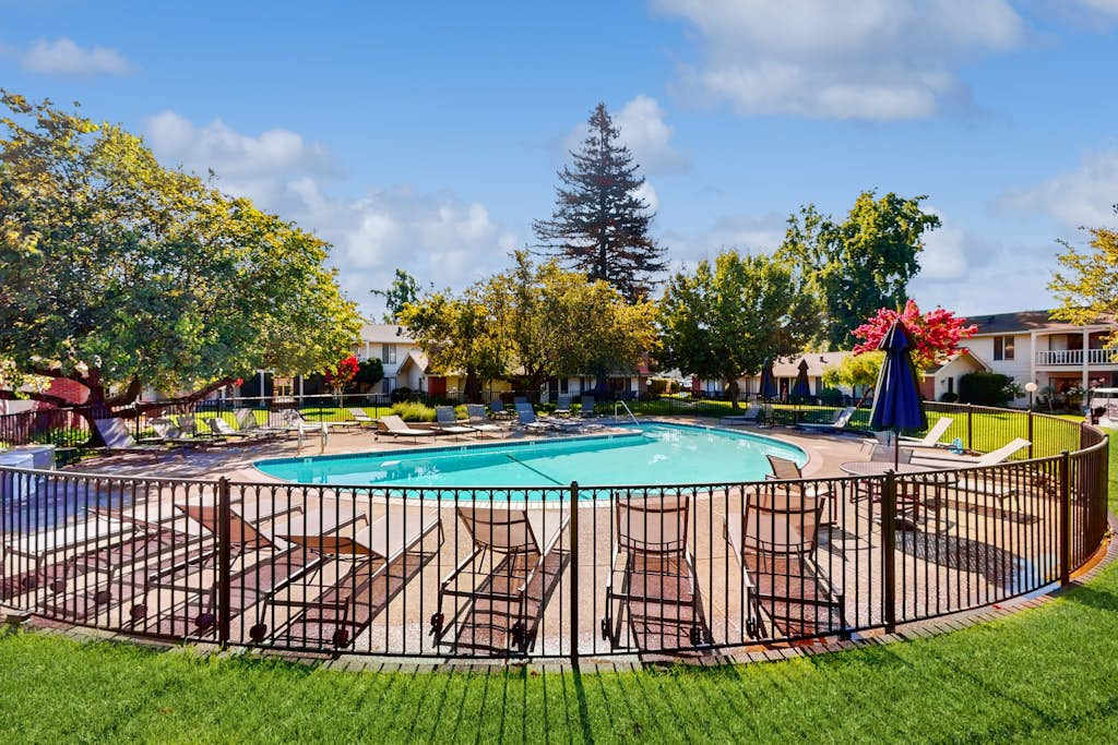 Cool off between Napa wine tastings at your community pool — fenced for privacy, lined with lounge chairs, and surrounded by mature shade trees.