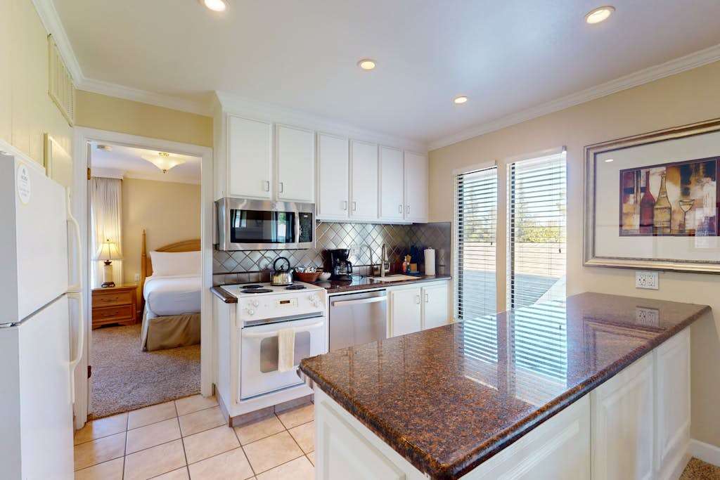 Prep your farm-to-table finds in the full kitchen featuring granite counters, a stove, microwave, coffee maker, and everything you need for a Napa feast.