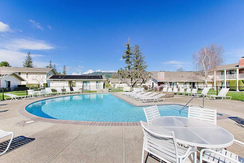 Take a refreshing dip in the sparkling resort pool surrounded by lounge chairs and blue Napa skies — your post-winery cool-down awaits.