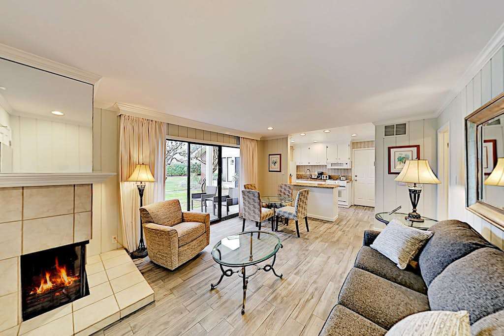 Settle into your Napa Valley retreat where a crackling fireplace, plush seating, and open-plan living invite you to unwind after a day of wine tasting.