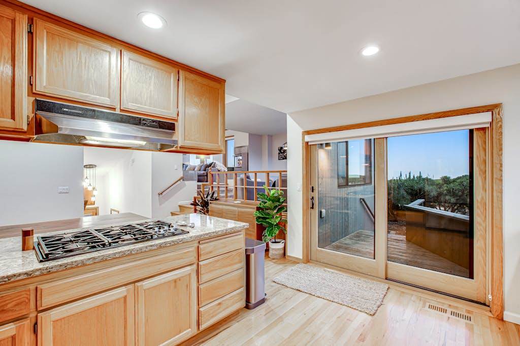 Step from your gas cooktop right onto the deck through sliding glass doors — perfect for grilling and entertaining on the Sonoma Coast