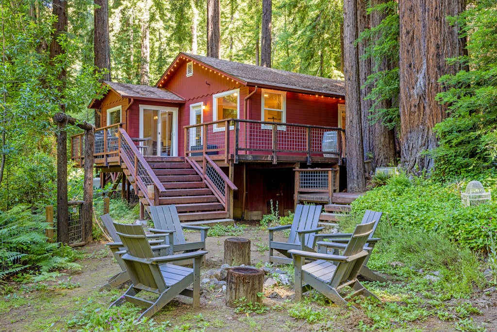 Step off your rear deck into a private redwood grove with Adirondack seating circled around a fire pit — your evening gathering spot under the canopy.
