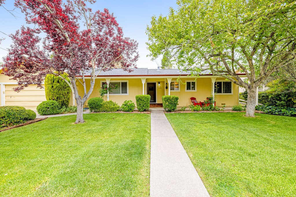 Welcome to your Kenwood wine country escape — a charming yellow ranch nestled among flowering trees and manicured gardens, steps from Sonoma Valley tasting rooms.