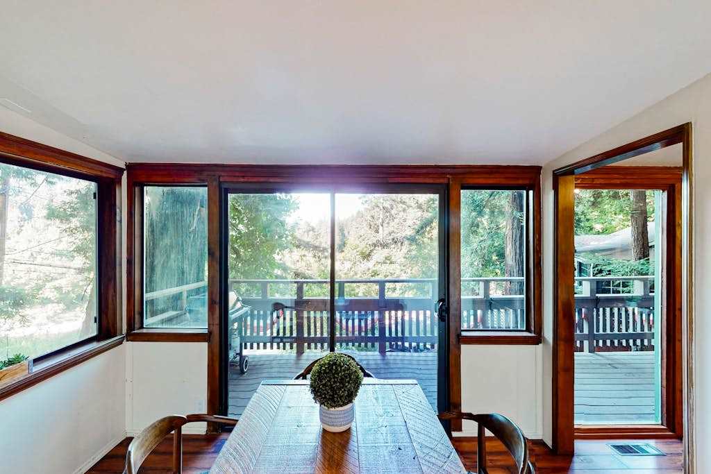 Dine among the redwoods without leaving your seat — wraparound windows frame towering trees and your private deck, making every meal a Russian River occasion.