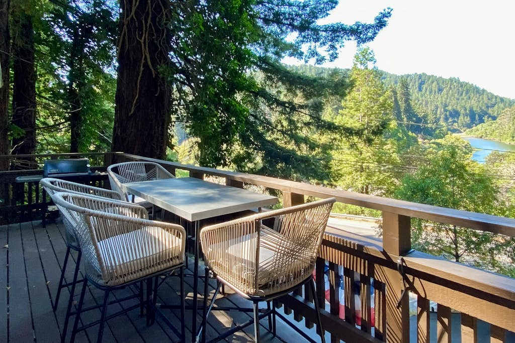 Pull up a wicker chair and dine alfresco on your sun-dappled deck — redwood branches arch overhead while the Russian River glimmers through the trees.