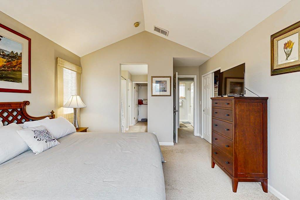 Wake up under vaulted ceilings in your primary suite with an en-suite bathroom, flat-screen TV, and ample dresser storage for longer wine country stays.