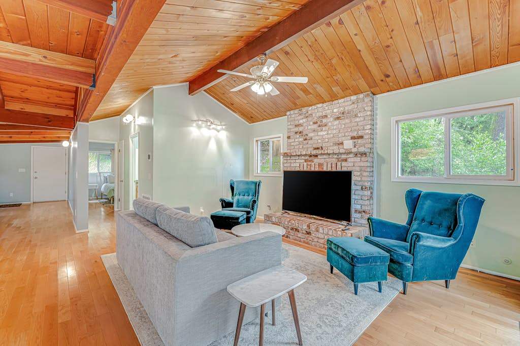 Generous open-concept living flows effortlessly under soaring tongue-and-groove ceilings — your home base for exploring Forestville's tasting rooms and river beaches.