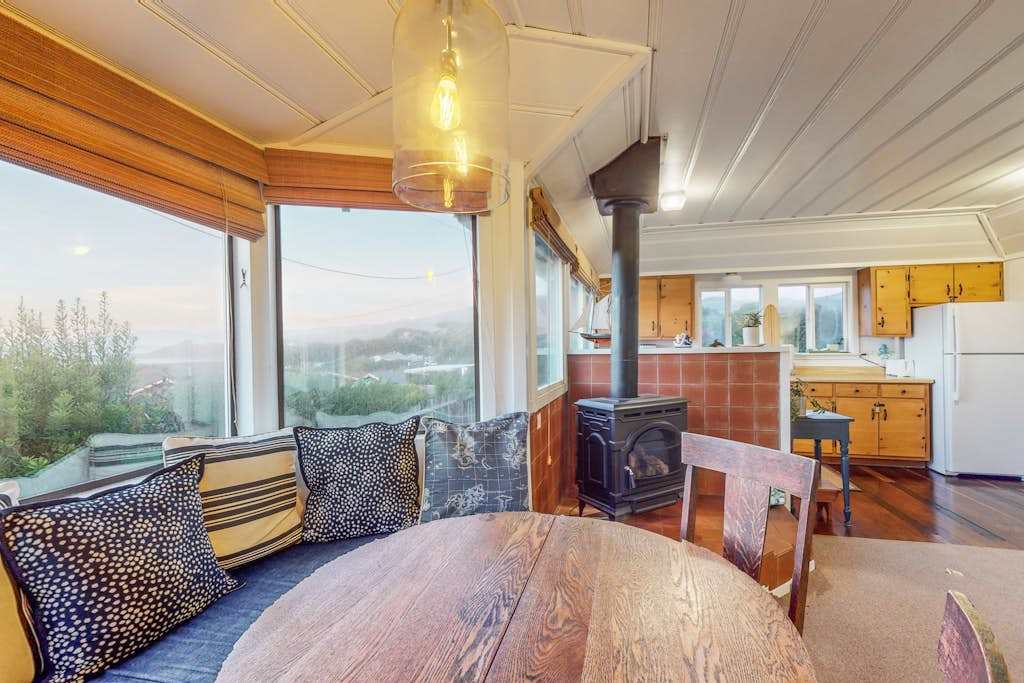 From cozy wood stove warmth to panoramic Sonoma Coast views, your dining nook wraps you in the best of Bodega Bay cottage living.
