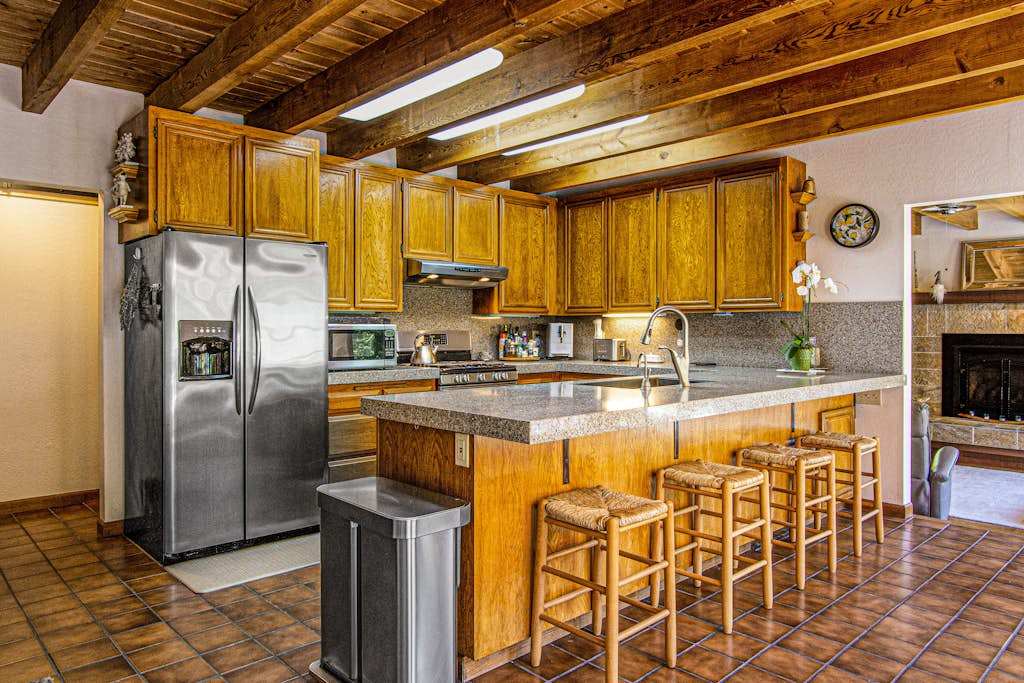 Cook like a local in your full chef's kitchen — stainless steel appliances, granite counters, a breakfast bar, and skylit beamed ceilings make meal prep a pleasure.
