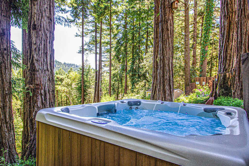 Soak away your wine country adventures in a private hot tub cradled by ancient redwood trunks — your own forest spa under the Sonoma sky.