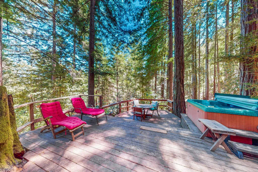 Settle into your private redwood-canopy deck where cushioned loungers and a bubbling hot tub create your own Cazadero forest spa beneath the treetops.