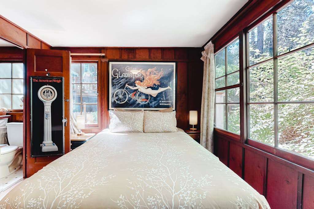 Wake to dappled sunlight filtering through the redwood canopy — your master suite offers tree-framed views from every window and a restful retreat after wine tasting.