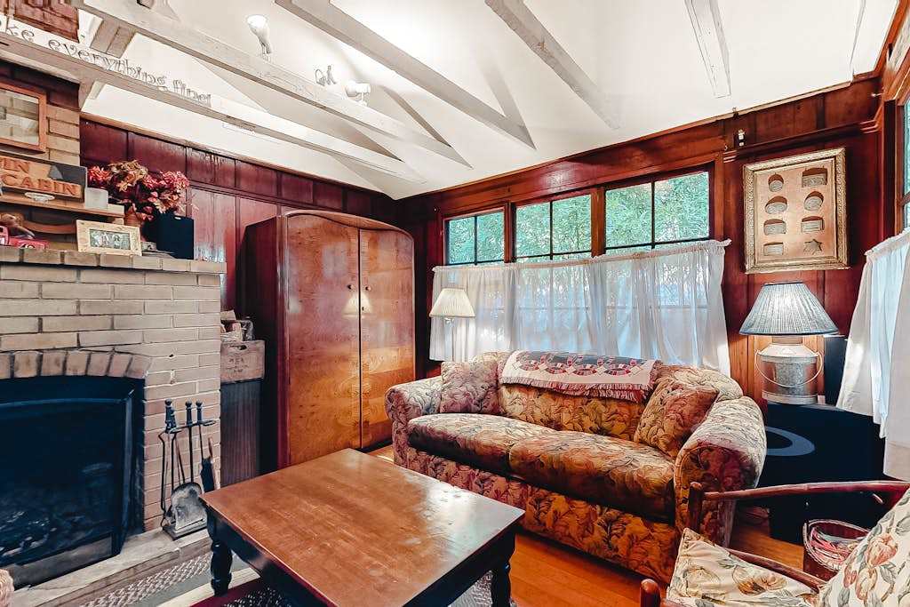 Curl up on the vintage sofa with a local wine — your living room's warm wood walls and soft lamplight make every evening feel like a Sonoma County escape.