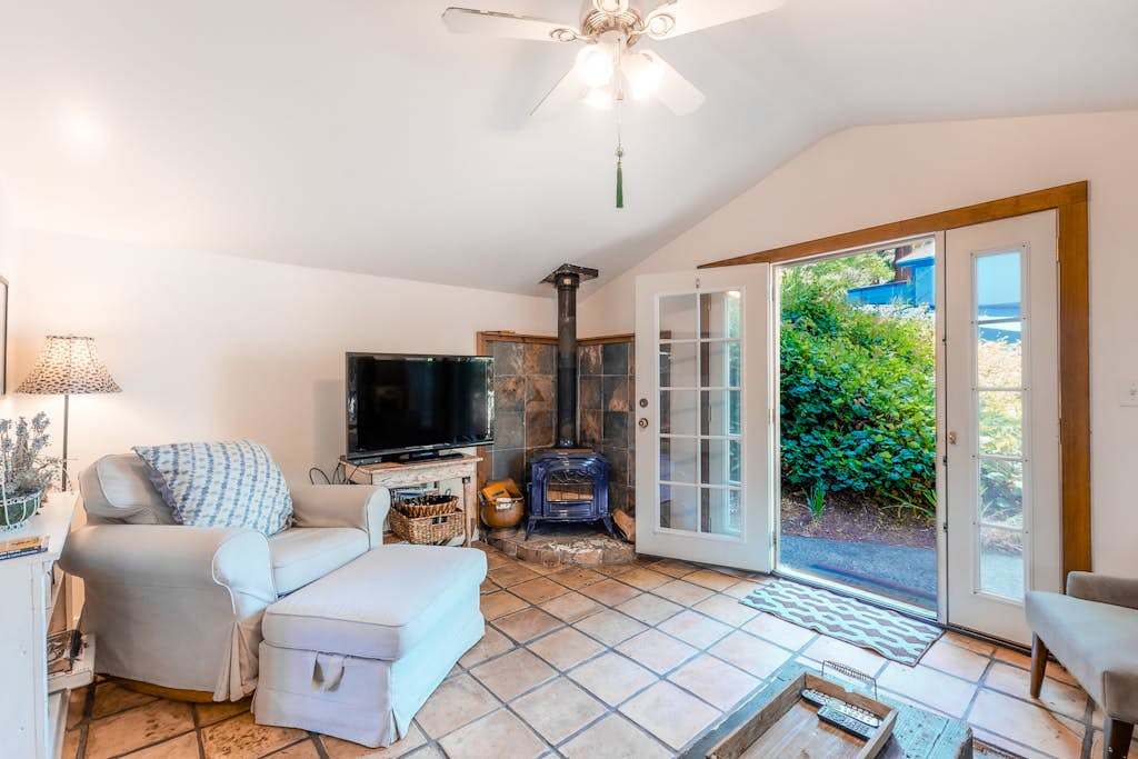 Cozy up by the wood-burning stove on cool vineyard evenings, then catch your favorite show on the flat-screen TV in this inviting living space.