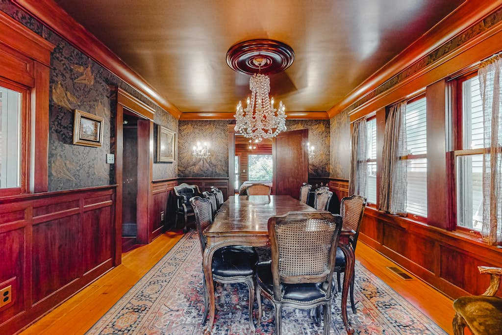 Every Sonoma supper feels like an occasion at your grand dining table — dark wainscoting, a glittering chandelier, and seating for the whole party.