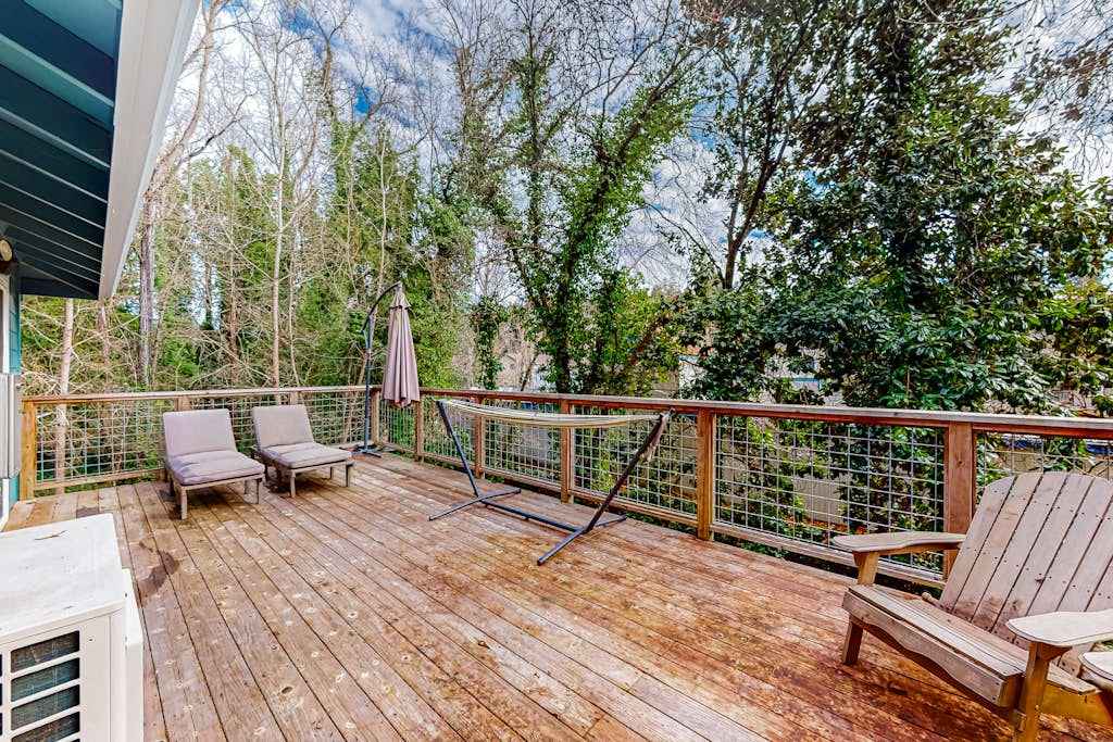 Unwind on your spacious upper deck with a glass of Sonoma County wine — Adirondack seating and a lounger await under the redwood canopy just steps from your door.