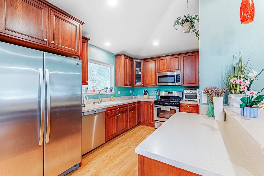 Everything you need to cook a feast — stainless dishwasher, gas stove, and generous counter space so you can prep your wine country charcuterie board in style.