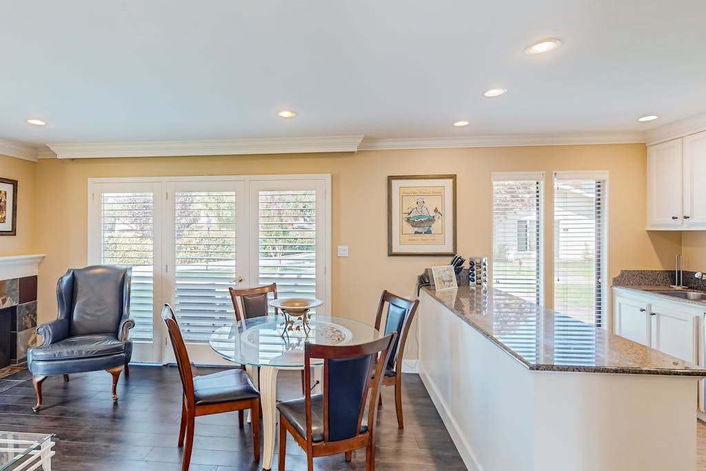 Enjoy farm-to-table Napa cuisine at your glass dining table with views through plantation shutters and a fully equipped kitchen steps away