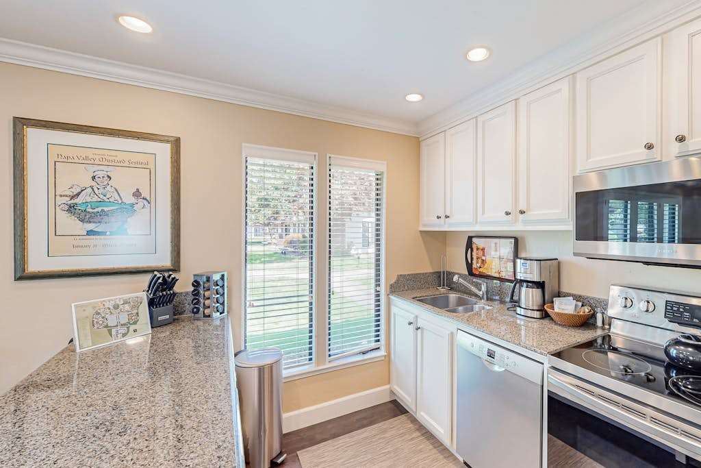 Prep your wine country charcuterie on granite countertops in this fully equipped kitchen with stainless appliances and a coffee station ready to fuel your day