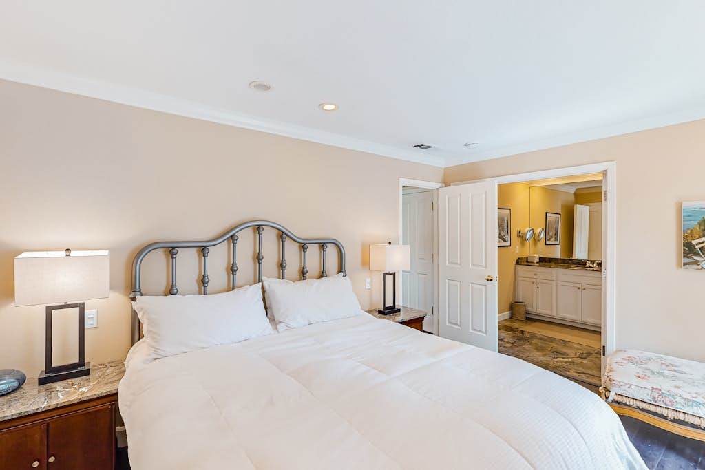 Drift off in your plush king bed with crisp white linens and bedside reading lamps — your en-suite bathroom is just steps away for ultimate Napa Valley comfort