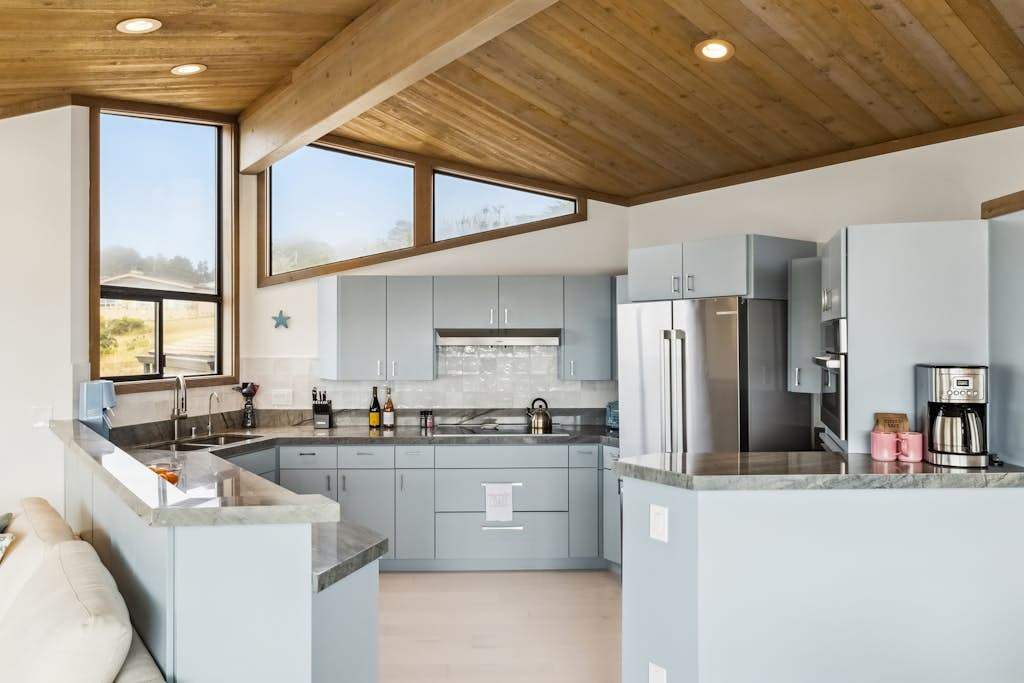 Channel your inner chef in this gourmet kitchen with granite counters, stainless steel appliances, and Bodega Bay views from every window