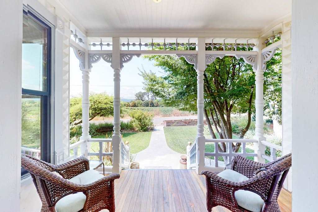 Settle into your private Victorian porch with wicker seating and gaze across the manicured Healdsburg garden — the perfect spot to sip your morning wine country coffee.