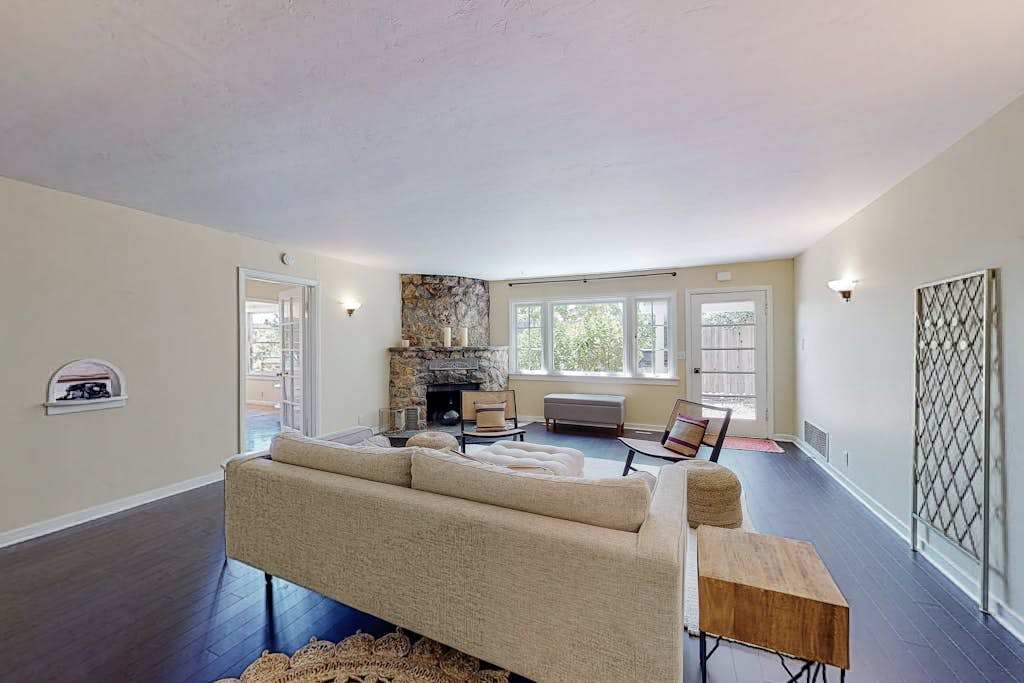 Stretch out in your light-filled living room where natural stone meets modern comfort — a welcoming retreat after strolling Healdsburg Plaza.