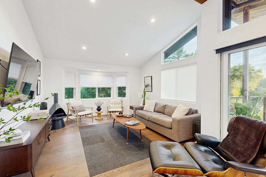 Sunlit living room with soaring ceilings and mid-century furnishings welcomes you after a day exploring Healdsburg's tasting rooms and boutiques.
