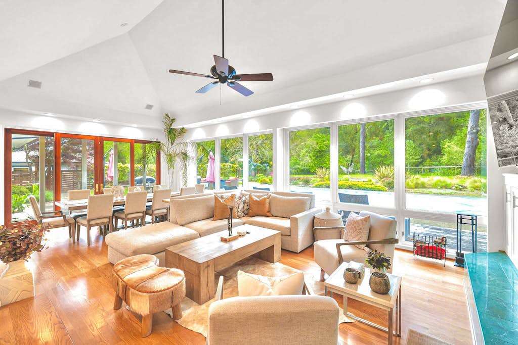 Walls of windows flood your great room with natural light — sink into plush seating and gaze out at the gardens after a day exploring Sonoma tasting rooms