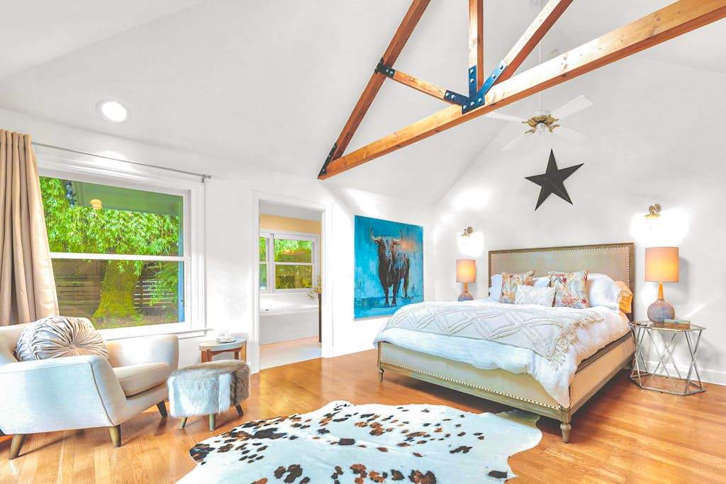 Retreat to your primary suite where soaring exposed beams, a skylight, and a king bed create a sanctuary worthy of Sonoma's finest wine country estates