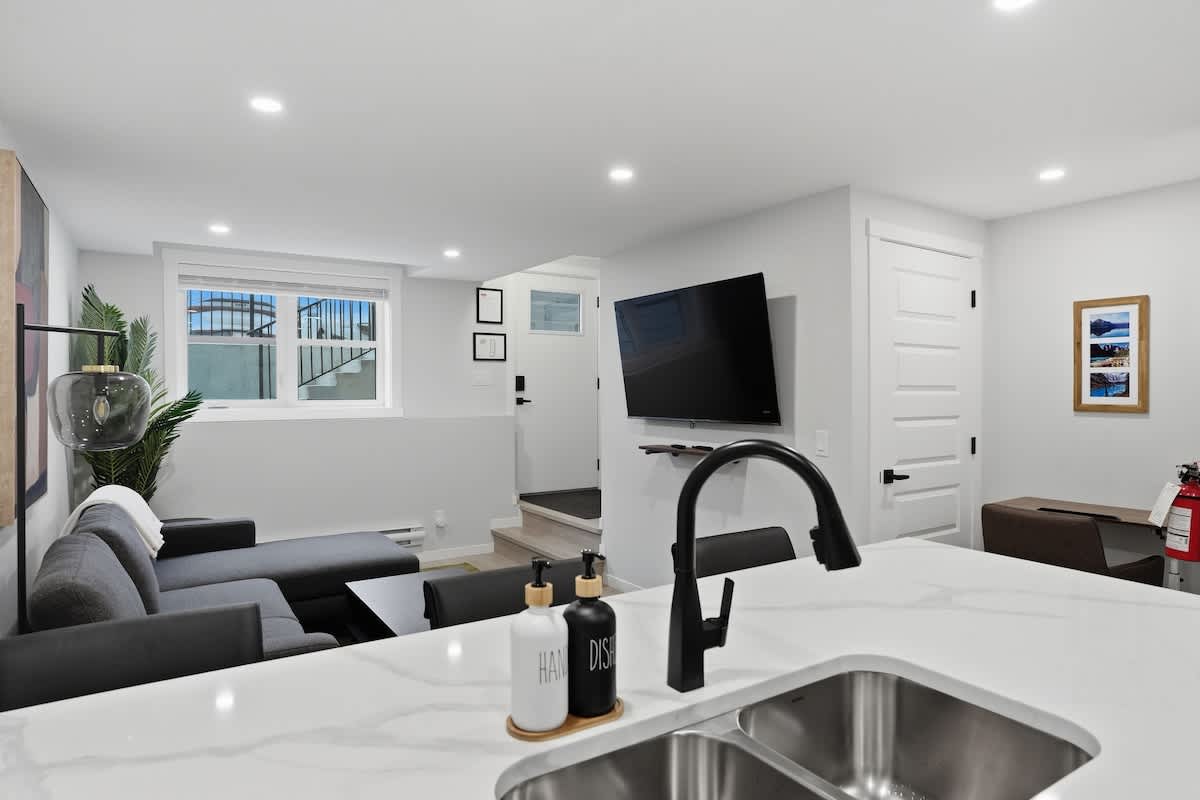 Alternate angle of living room and front entrance