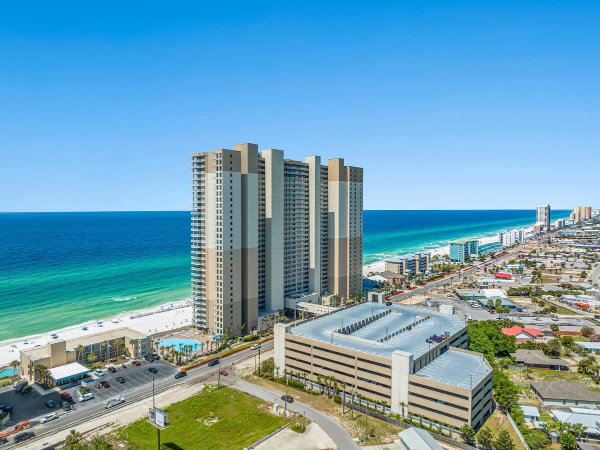 Tidewater 2615 – Aerial view of Tidewater 2615, beach, ocean, and surrounding buildings with a clear blue sky.