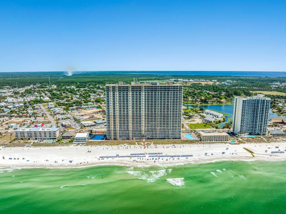 Tidewater 2615 – Aerial view of Tidewater 2615, featuring beach, ocean, and nearby tall buildings.